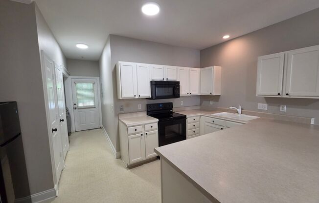 Charming 2 Bed/2 Bath Main Floor Condo - Close to Downtown Cornelius - Spacious Kitchen - Washer/Dryer Included - Community Pool - Sidewalks