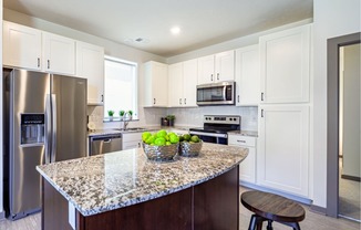 Large kitchens with stainless steel appliances at Park125 West Dodge apartments in Omaha, NE