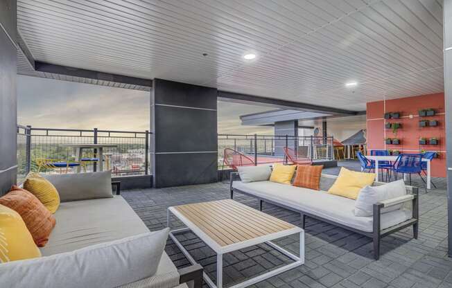 a living room with couches and chairs and a table