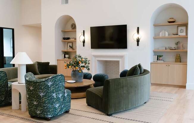 Resident clubhouse with open layout, modern furniture, and large windows