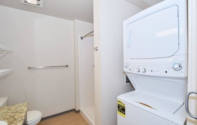 a washer and dryer in a bathroom