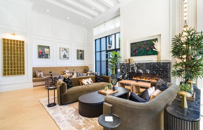Resident lounge with layered seating, a statement fireplace, and curated finishes creating a comfortable space for conversation and everyday gathering.