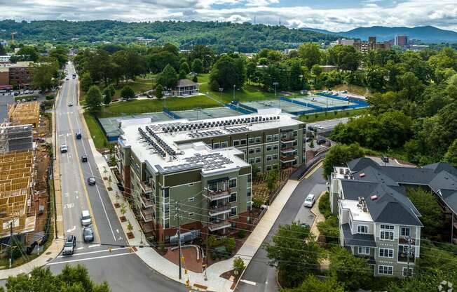 an aerial view of a city with buildings and a parking lot