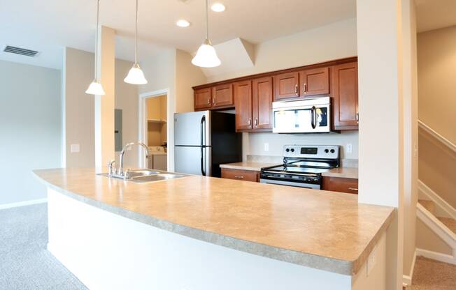 a kitchen with a large counter top and a sink