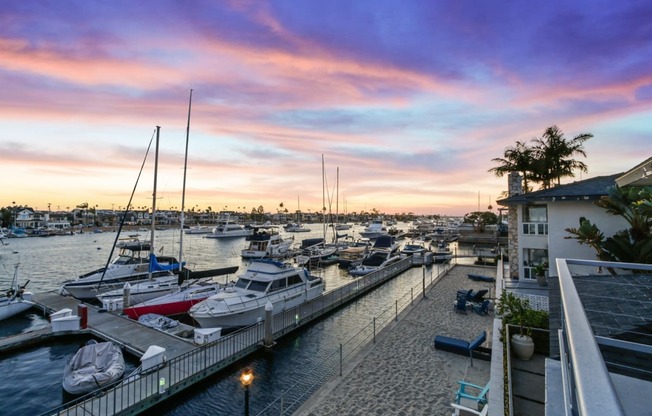 a marina with boats docked at sunset