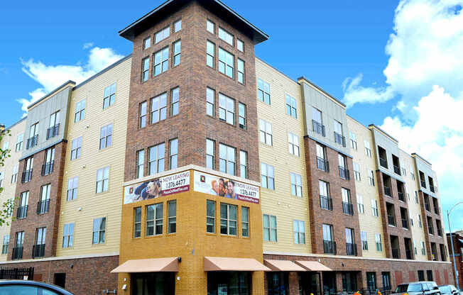 A multi-story building with a sign that reads "1334477" and "YOUNG STARS INN".