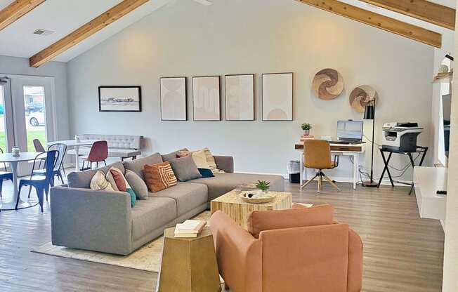 a living room with couches and chairs and a dining room table