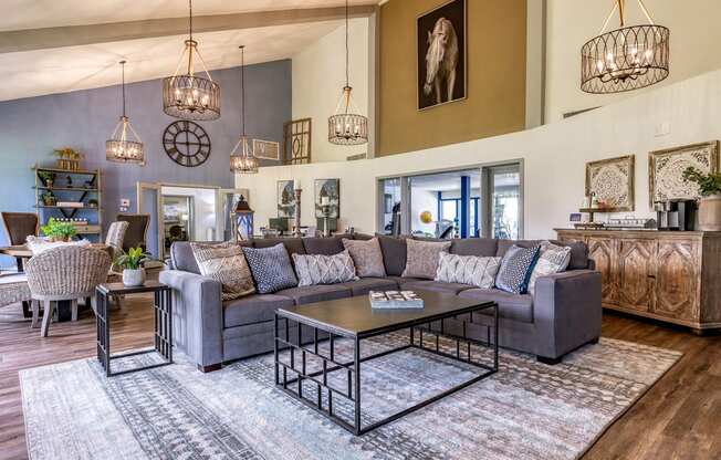 a living room with couches and chairs and a table