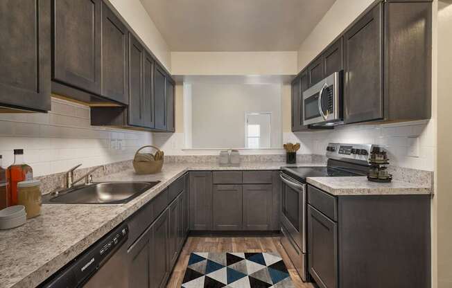 Kitchen with mosaic tiles at The Apartments at Owings Run, Maryland