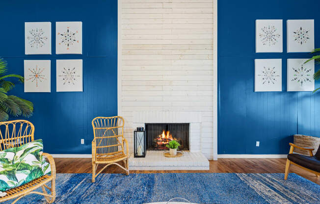 a living room with a fireplace and blue walls