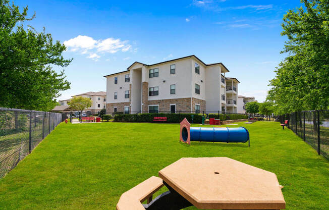 our apartments showcase a dog park with plenty of room to run and play