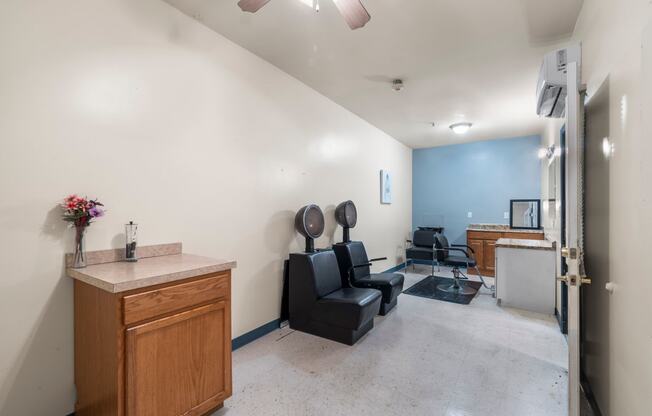 a dentist office with a chair and a counter and a exam room