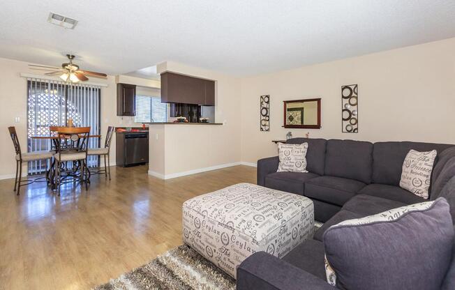 a living room filled with furniture and a flat screen tv