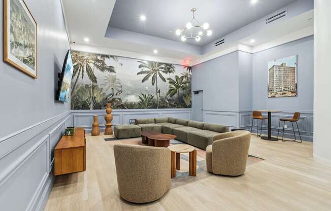 A living room with a couch, chairs, and a coffee table.