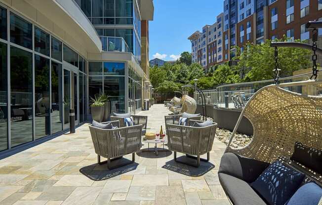 a patio with chairs and tables on a patio