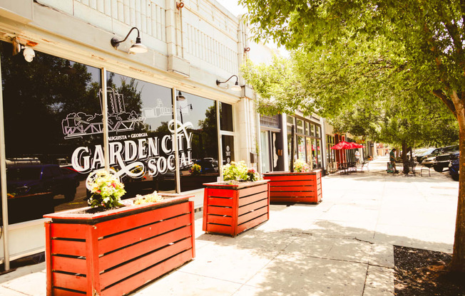 the sidewalk in front of a store called garden city soap