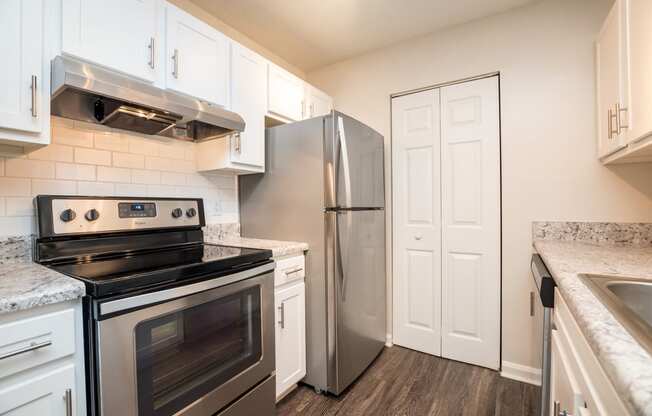 model apartment kitchen with stainless steel appliances at Palmetto Place, Fort Mill, 29708