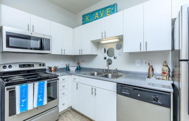 a kitchen with a stove and a microwave