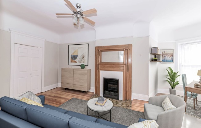 a living room with white walls and a blue couch