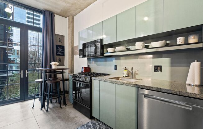 **FURNISHED** Streetcar Lofts studio w/parking/storage/Juliette balcony/fitness center/courtyard garden