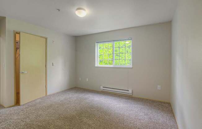 A room with a window and a door.