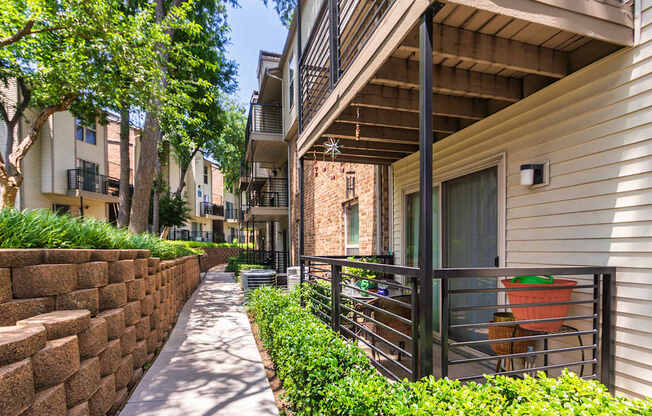 Walkway through apartment complex at Canyon Creek Apartments in the Dallas Midtown neighborhood of Dallas, TX.