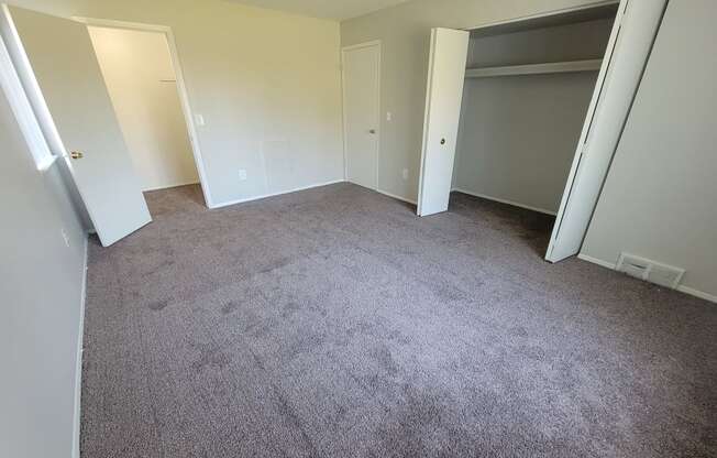 Spacious bedroom with large closet at Garfield Commons in Clinton Township, MI