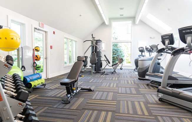 Beverly Commons fitness center benth weights and cardio equipment