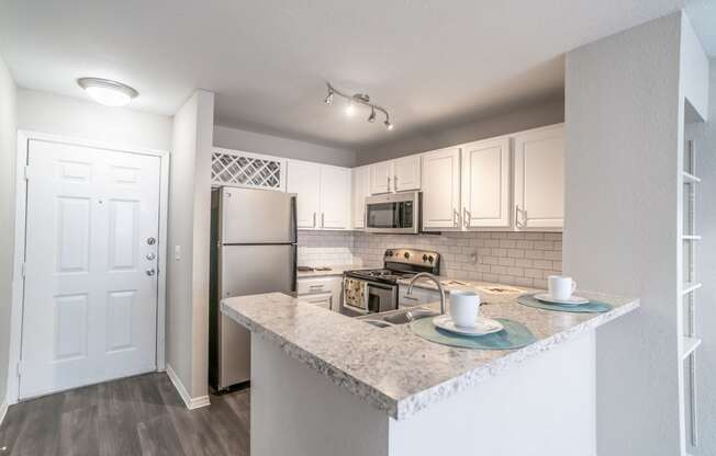 Kitchen at Mission Club Apartments in Orlando, FL