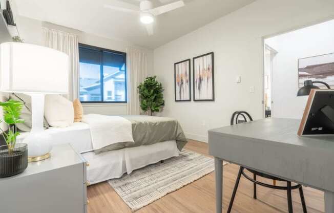 a bedroom with a bed and a desk and a window at Sonder Fields in Happy Valley, OR