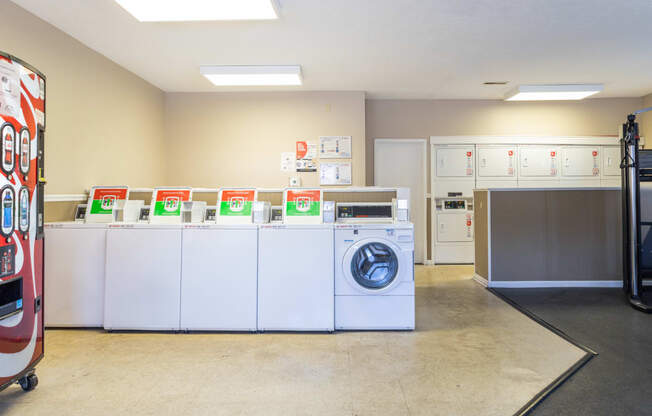 Laundry Center with coin and app-based operated machines at Briarwood Apartments in Columbus, IN