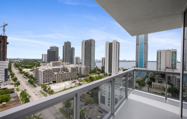 a view of the miami skyline from a balcony