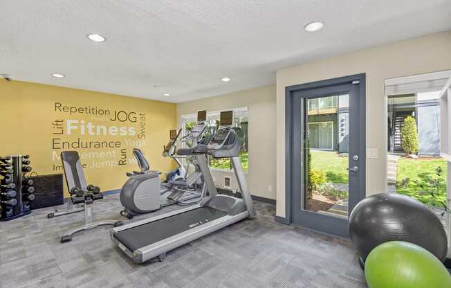 the gym at the enclave at woodbridge apartments in sugar land, tx