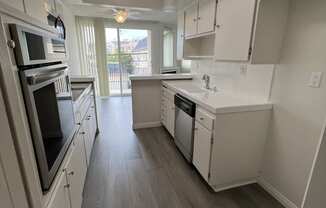 Kitchen with Stainless Steel Appliances and White Cabinets