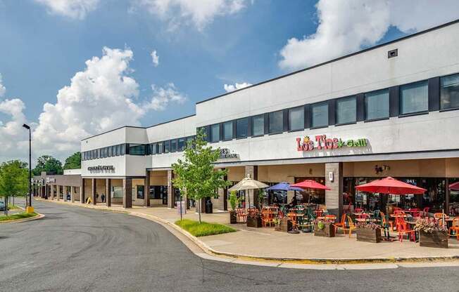 A street view of a shopping area with a store named