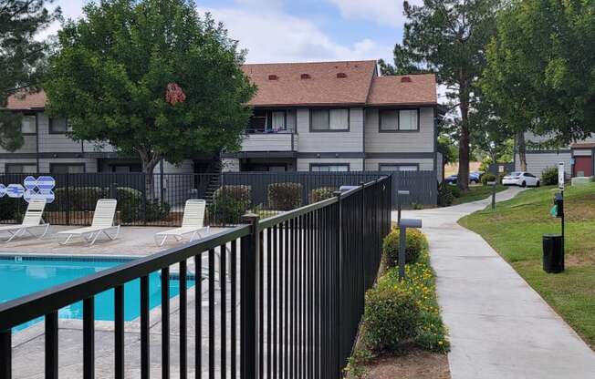Dove Ridge scenic path by fenced pool area.