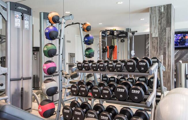 the gym at the flats at big tex apartments in san antonio, tx