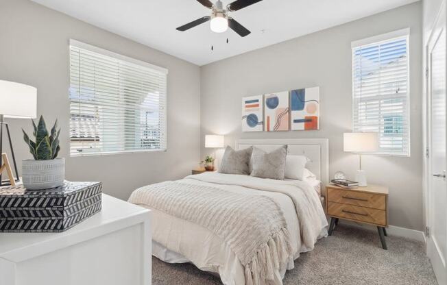 a bedroom with a bed and a ceiling fan at Arrive Temecula