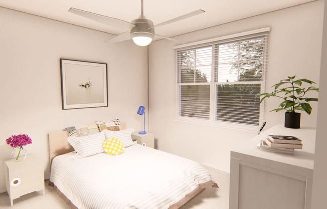 a bedroom with a bed and a ceiling fan at Brownstones at Palisade Park Townhomes, Broomfield