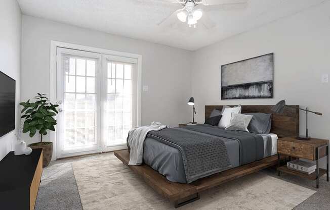 a bedroom with a bed and a ceiling fan