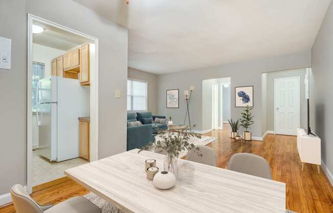 Apartment living and dining area (virtually staged) at Mason Hall in Alexandria, VA 22314