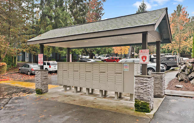 A parking lot with a covered area and a sign that says "No Parking".