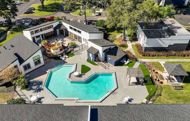 a house with a swimming pool in front of it