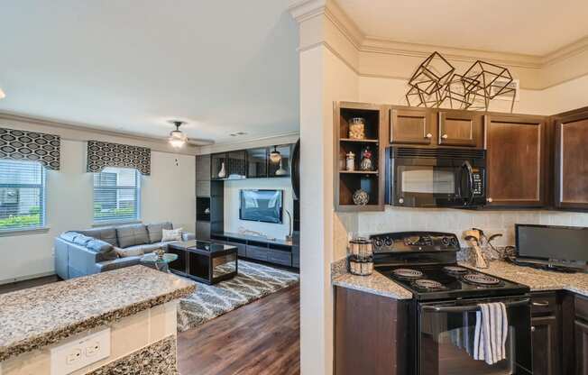 a kitchen and living room with a counter top