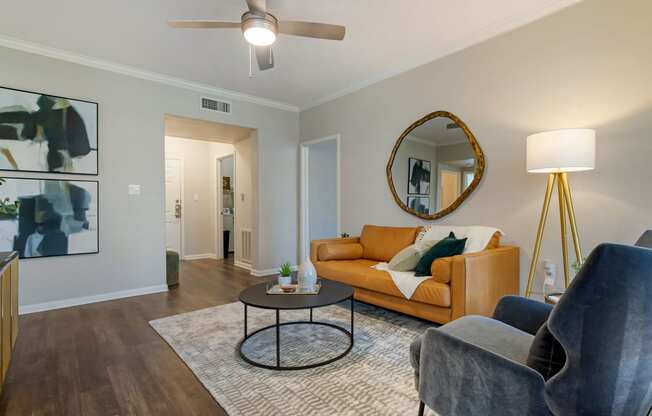 a living room with a couch and a coffee table at Madison on the Meadow, Stafford, Texas