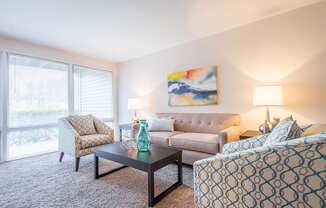 Light filled living room at Brook View Apartments, Baltimore, MD, 21209