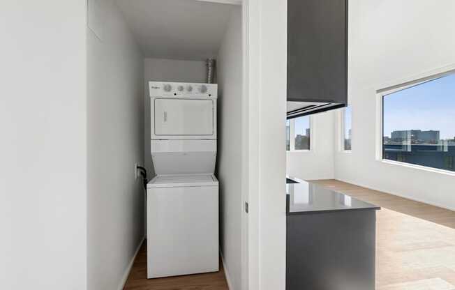 A white oven and microwave in a small kitchen.