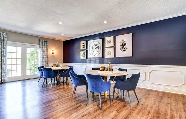 Clubhouse dining area at Ashton Brook Apartments, featuring a tables and seating.