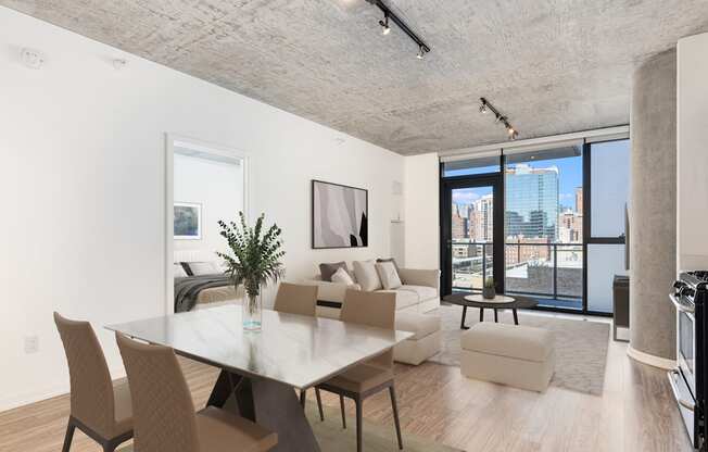 a living room with a table and chairs and a couch at One 333, Chicago, Illinois, 60605