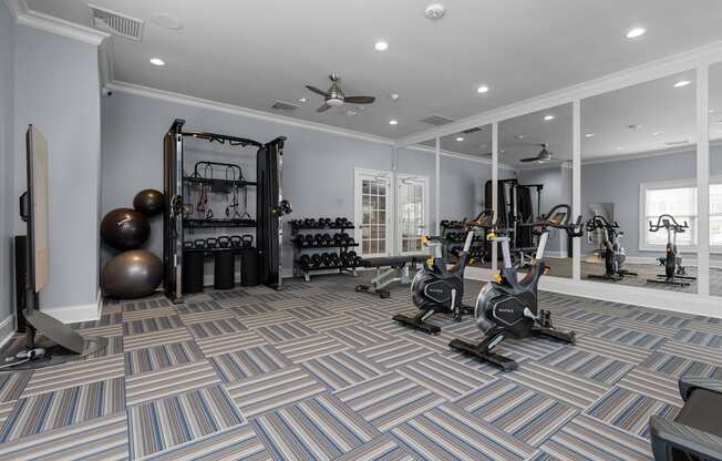 A spacious home gym with a variety of exercise equipment.